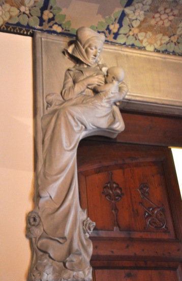 A wet nurse, stone relief in the entrance hall